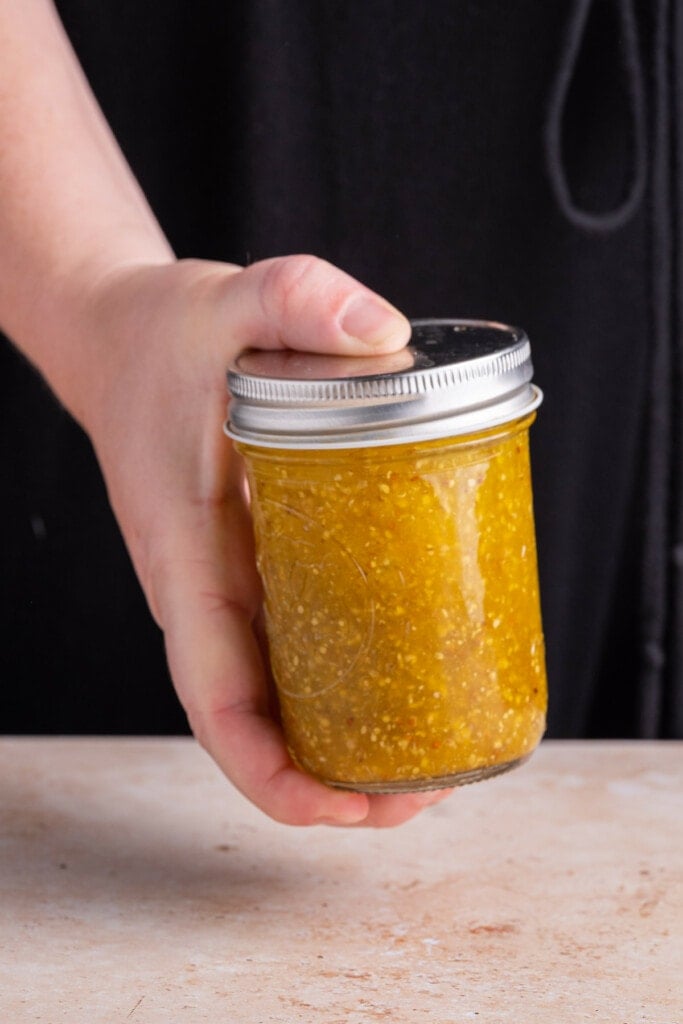 Shaking Maple Dijon Vinaigrette in a jar