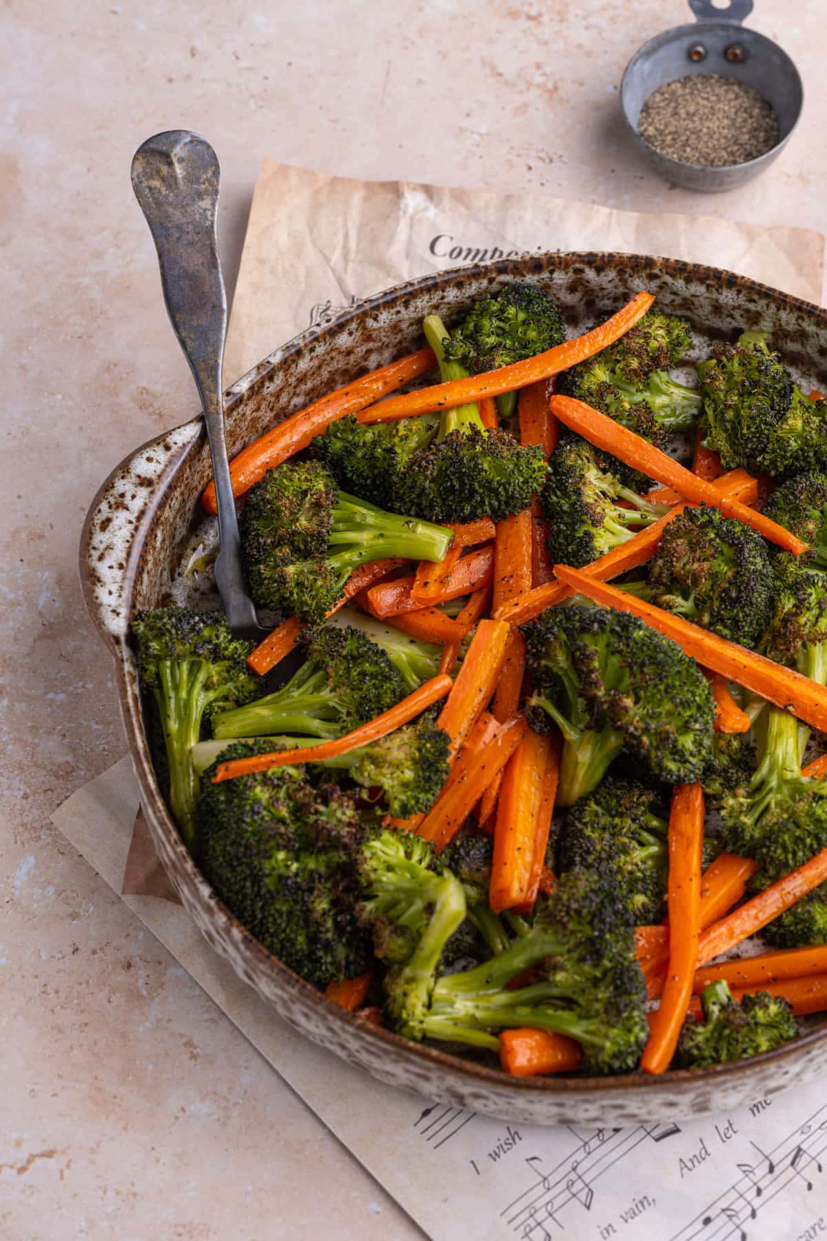 Roasted Broccoli and Carrots with a serving spoon
