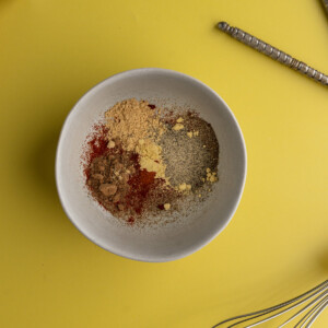 Adding all Old Bay Seasoning ingredients to a bowl