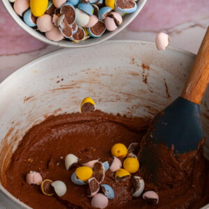 Adding crushed Mini Eggs to brownie batter