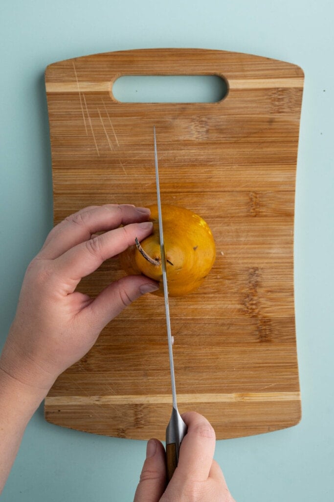 Cutting pear in half lengthwise