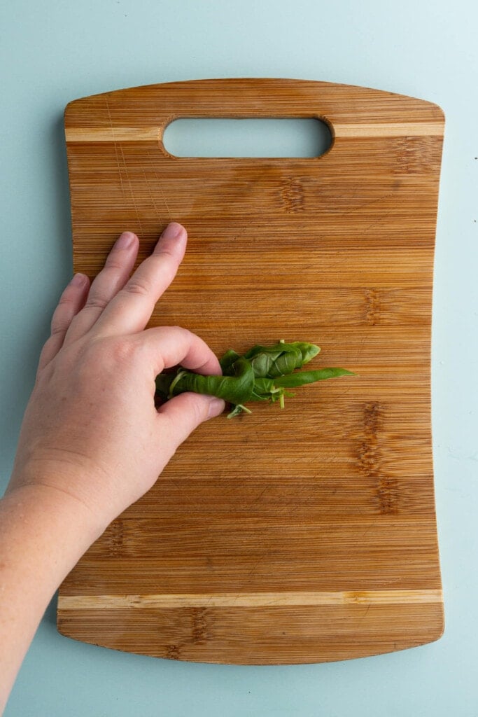 Rolling up basil to more easily chop it