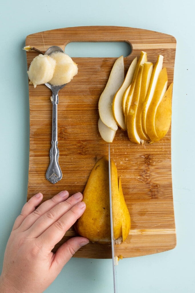 Slicing pear in into thin pieces