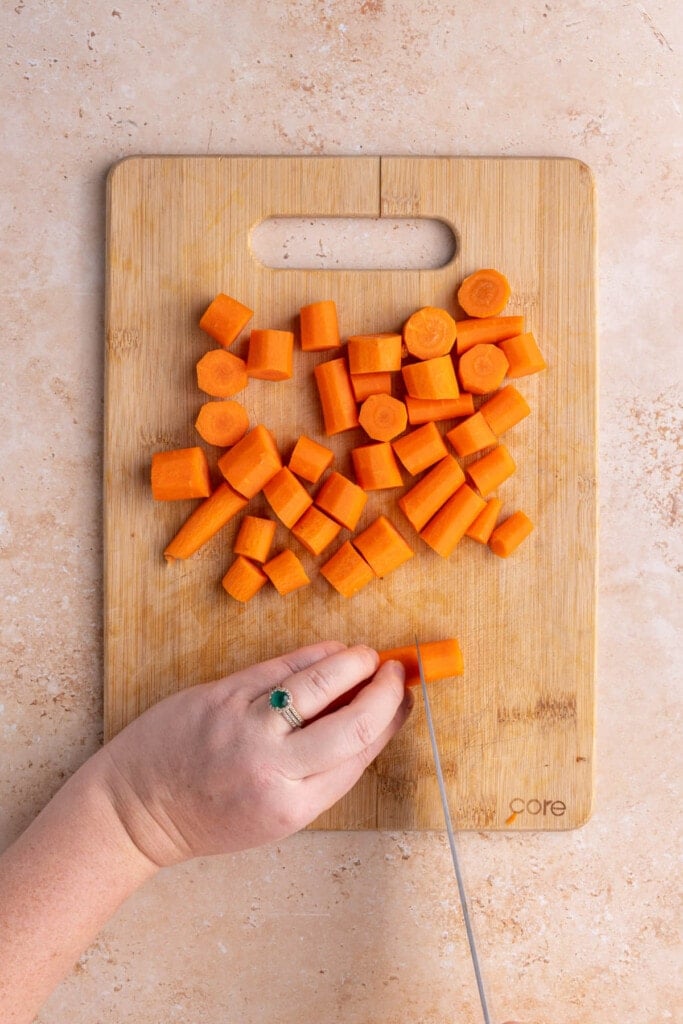 Cutting peeled carrots into coins