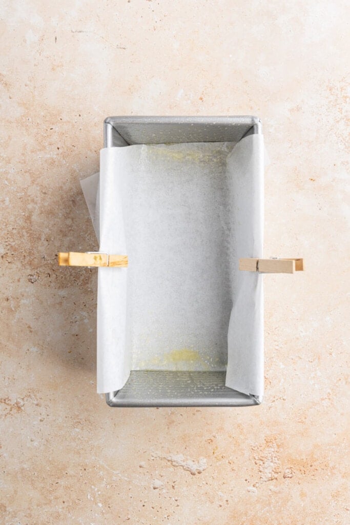 Pan half-lined with parchment paper.