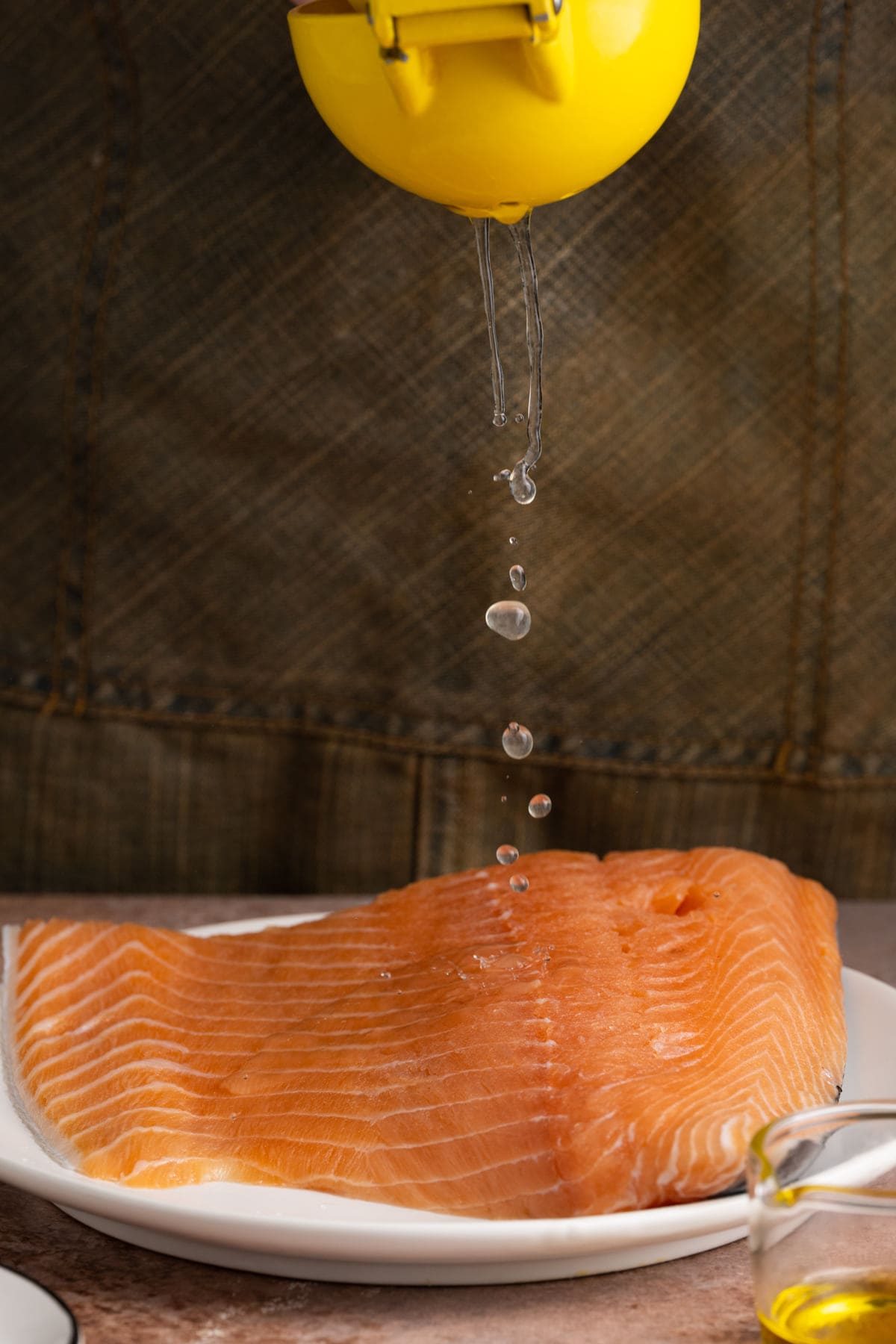 Adding fresh lemon juice to salmon