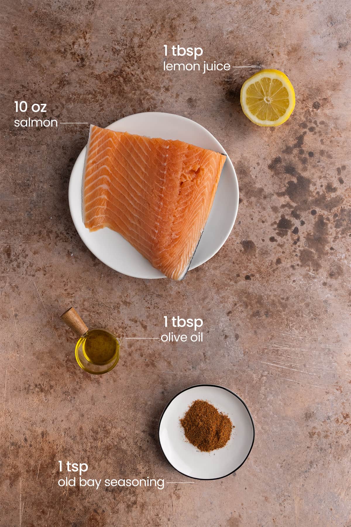 ingredients for old bay salmon - lemon juice, salmon, olive oil, old bay seasoning