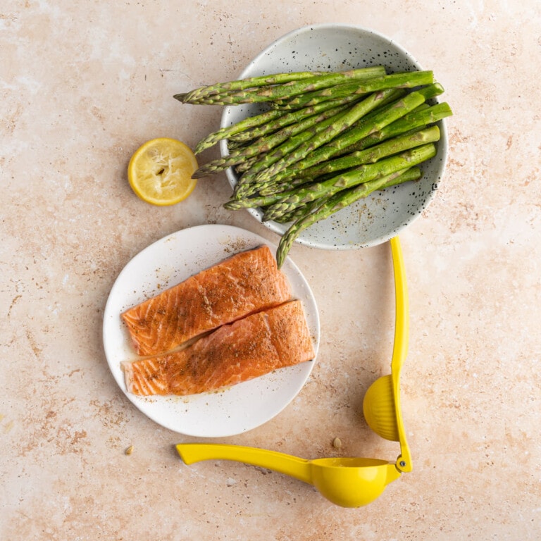 Salmon and asparagus coated in Old Bay, olive oil, and lemon juice
