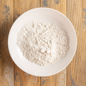 Flour in a shallow bowl ready for breading salmon