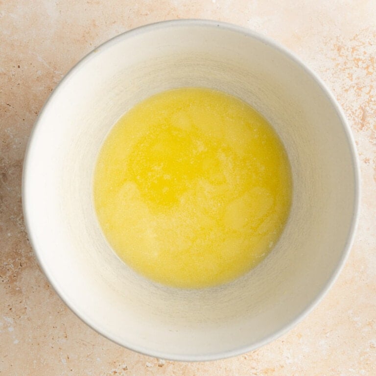 Unsalted butter completely melted in a bowl