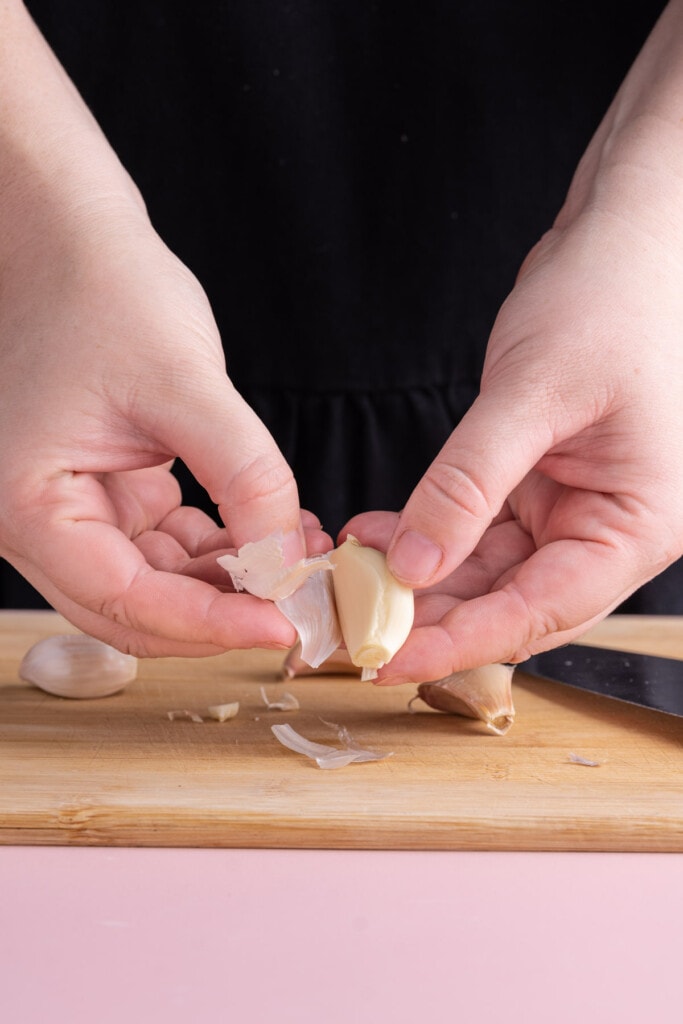 Peeling outer layer off of garlic