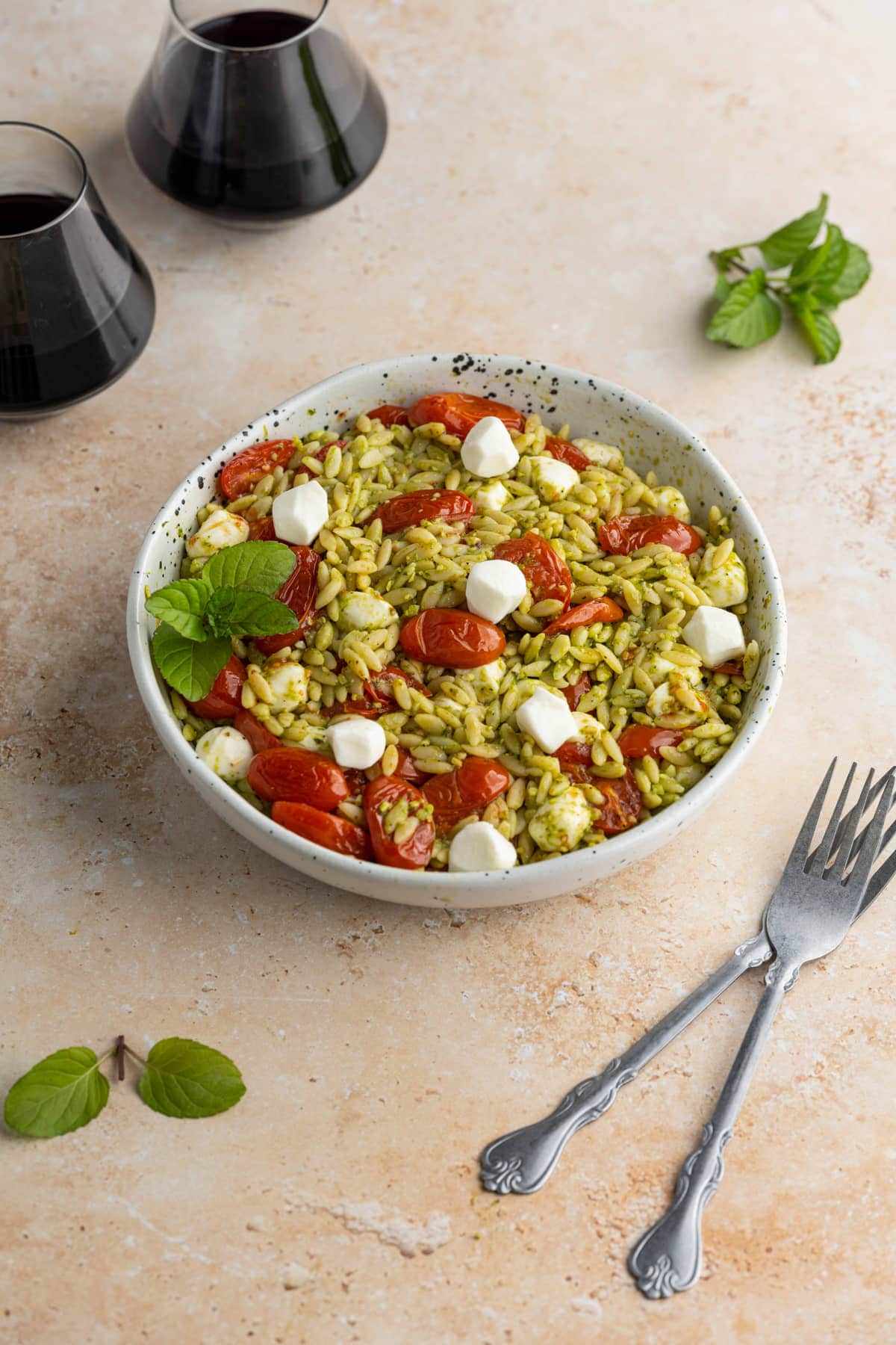 Pesto Orzo Salad served with red wine