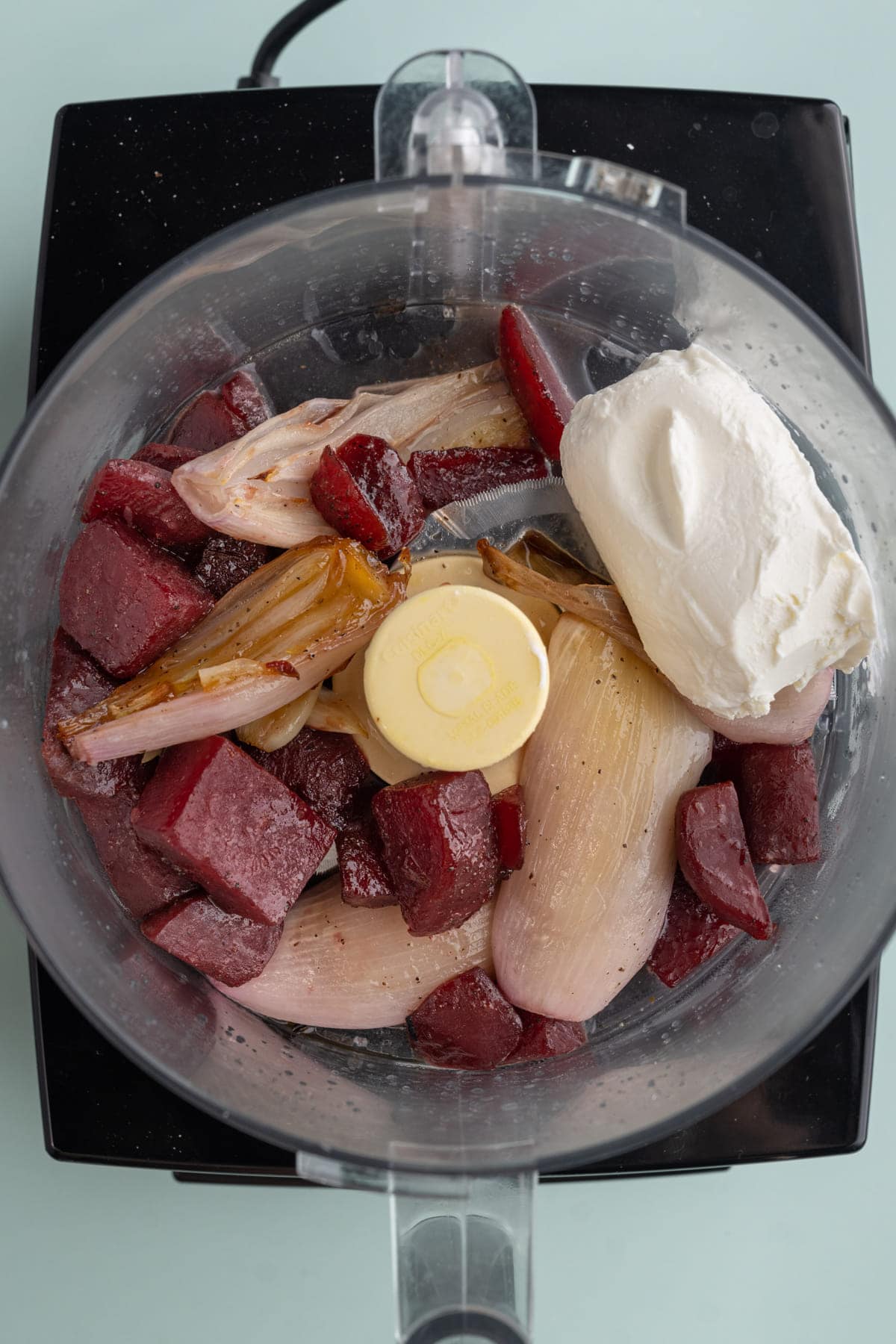 Roasted beets, shallots, and garlic in food processor with lemon juice and goat cheese