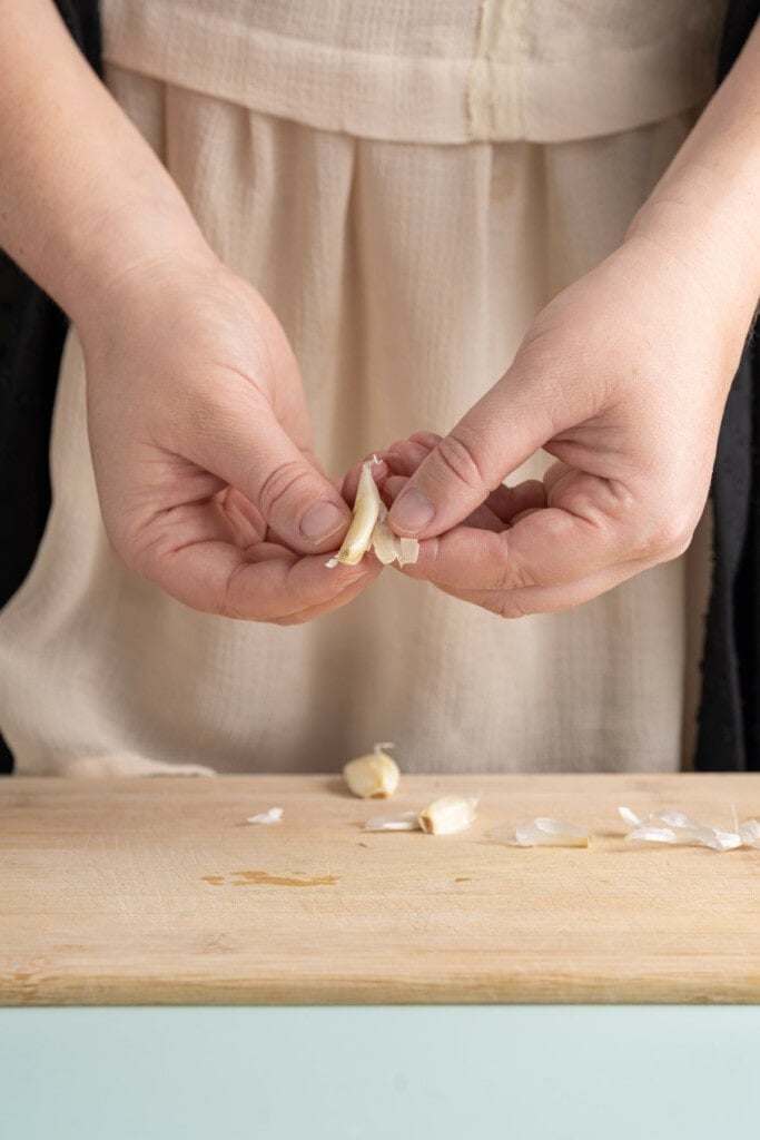 Peeling garlic to roast it with beets