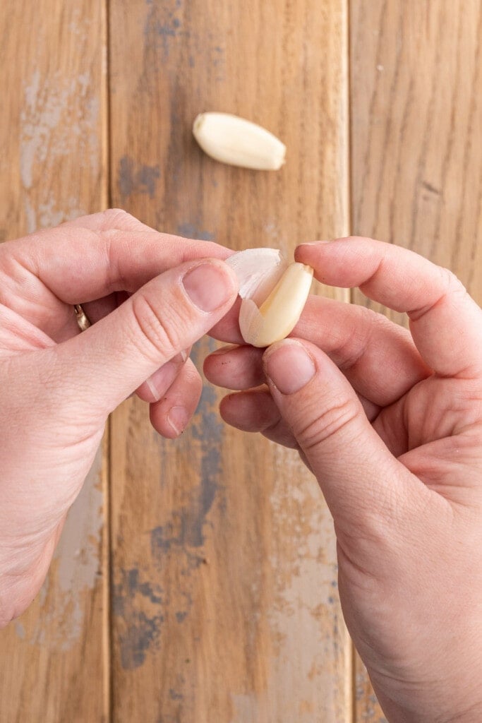 Peeling garlic to mince it