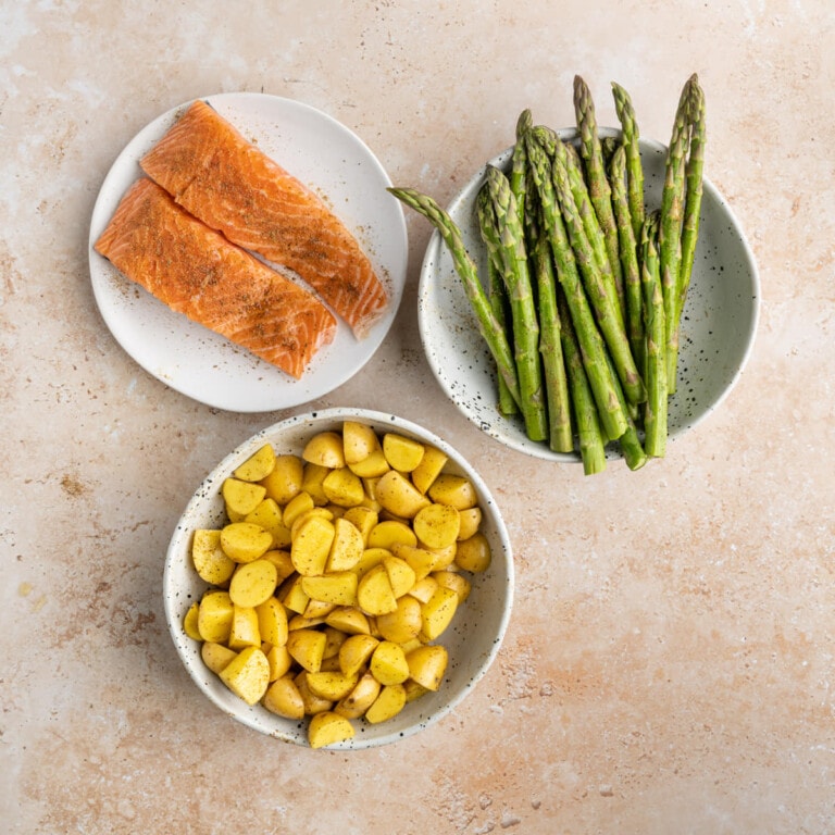 Salmon, asparagus, and potatoes coated in Old Bay Seasoning
