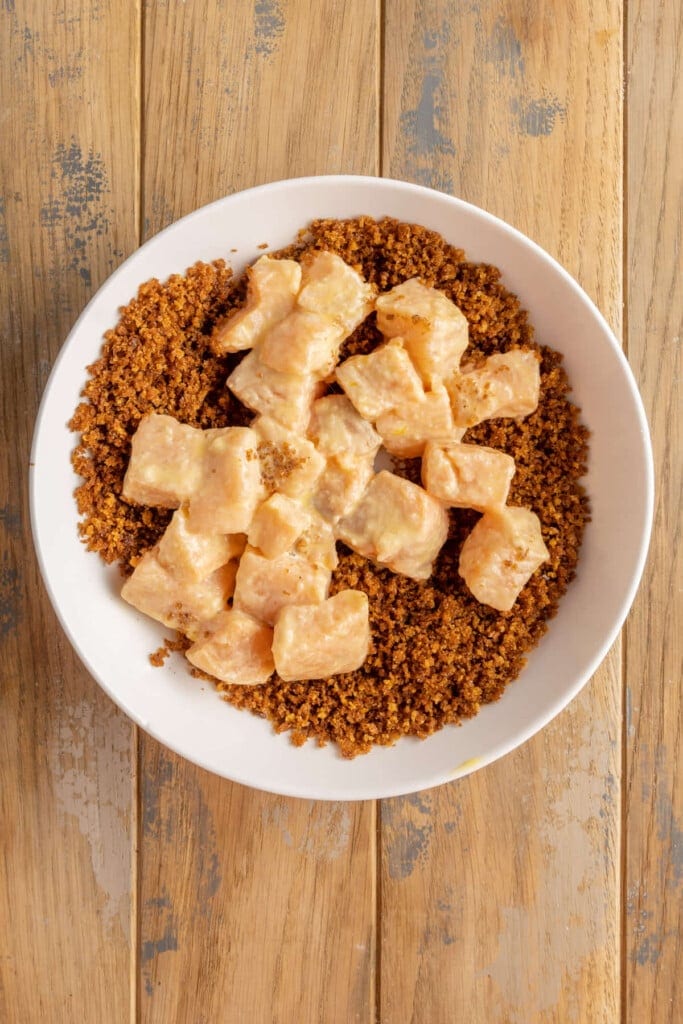 Coating salmon nuggets in toasted breadcrumbs