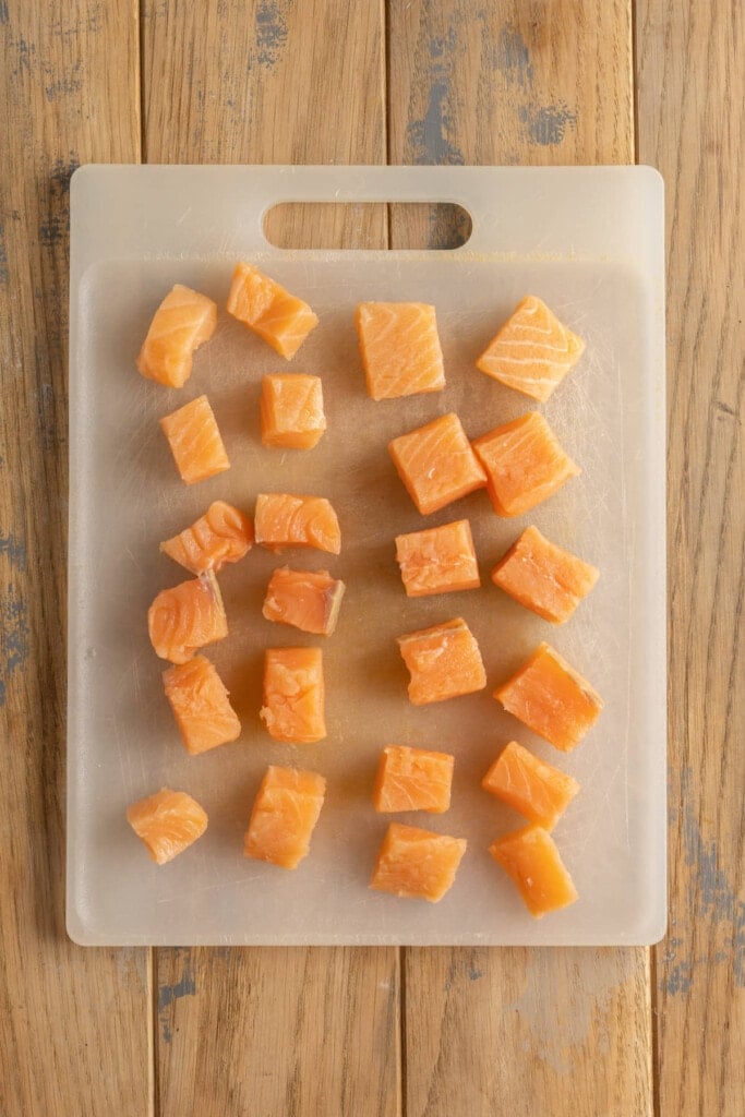 Cubing salmon to make salmon nuggets.