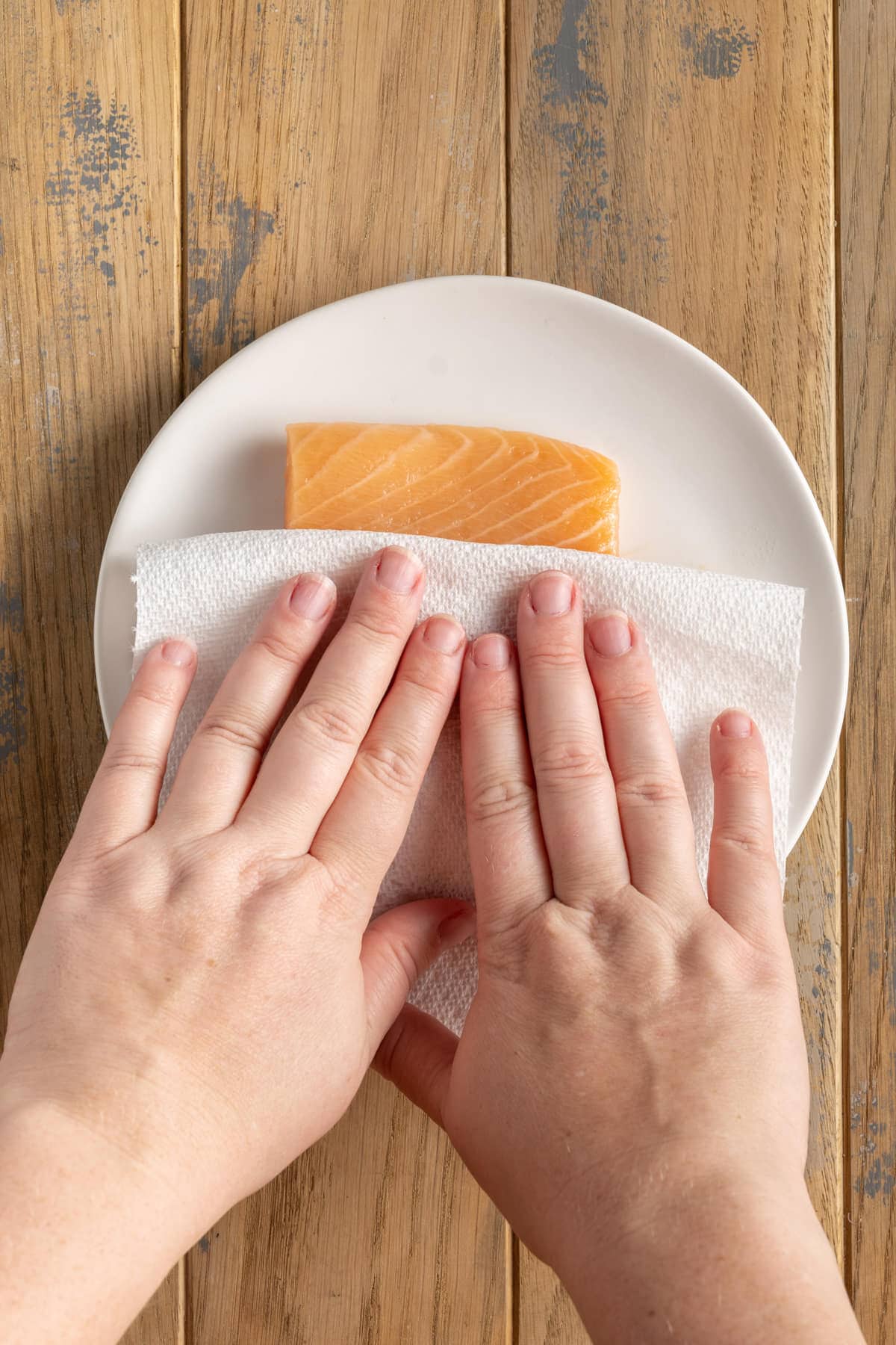 Patting salmon dry before coating in breading