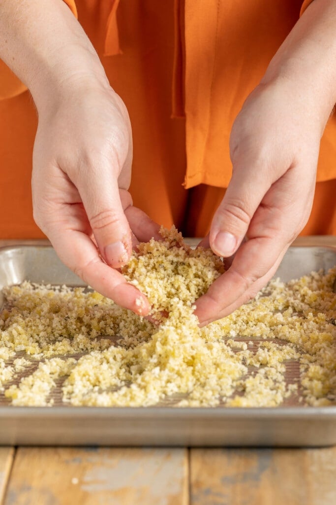 Tossing panko breading with oil to toast it