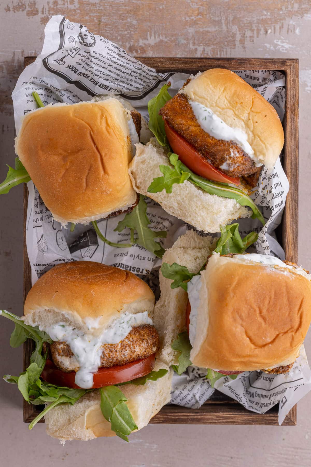 4 Salmon Sliders on a wooden tray