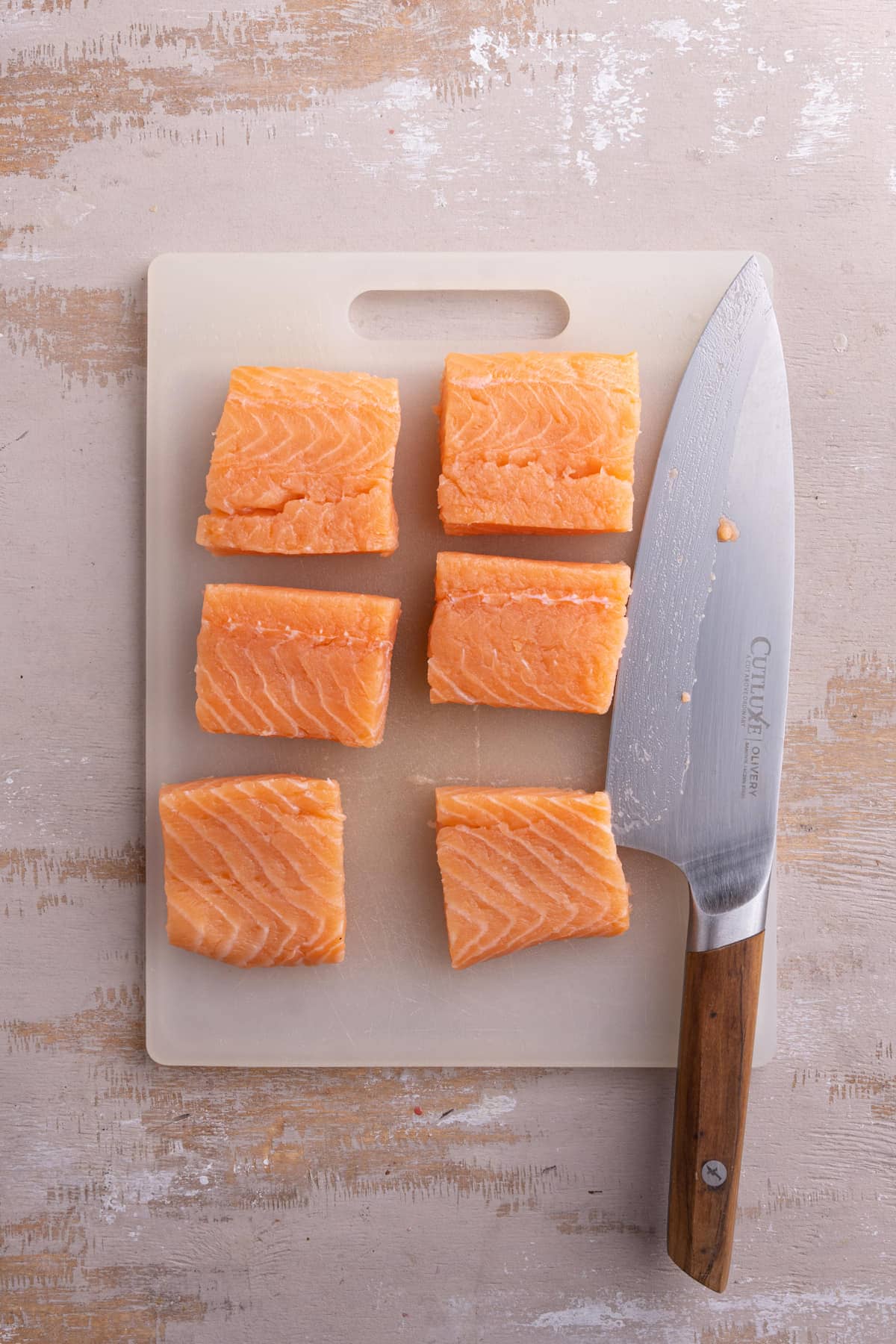Slicing salmon into slider-sized pieces