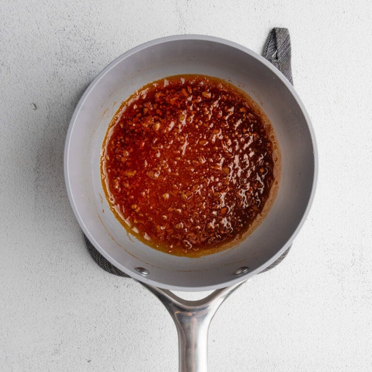 Thickening Honey Garlic sauce in a saucepan