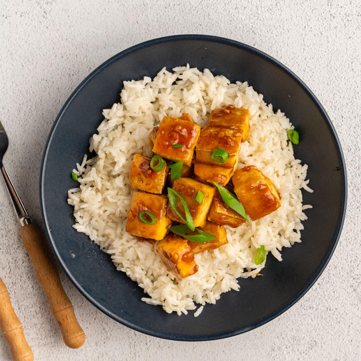 Honey Garlic Tofu served over a bed of rice