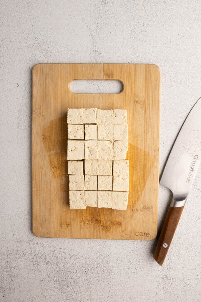 Slicing tofu into uniform cubes