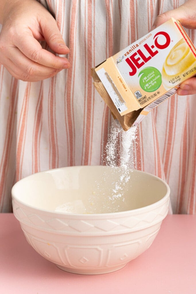 Adding pack of instant vanilla Jell-O to cold milk to make Oreo dip
