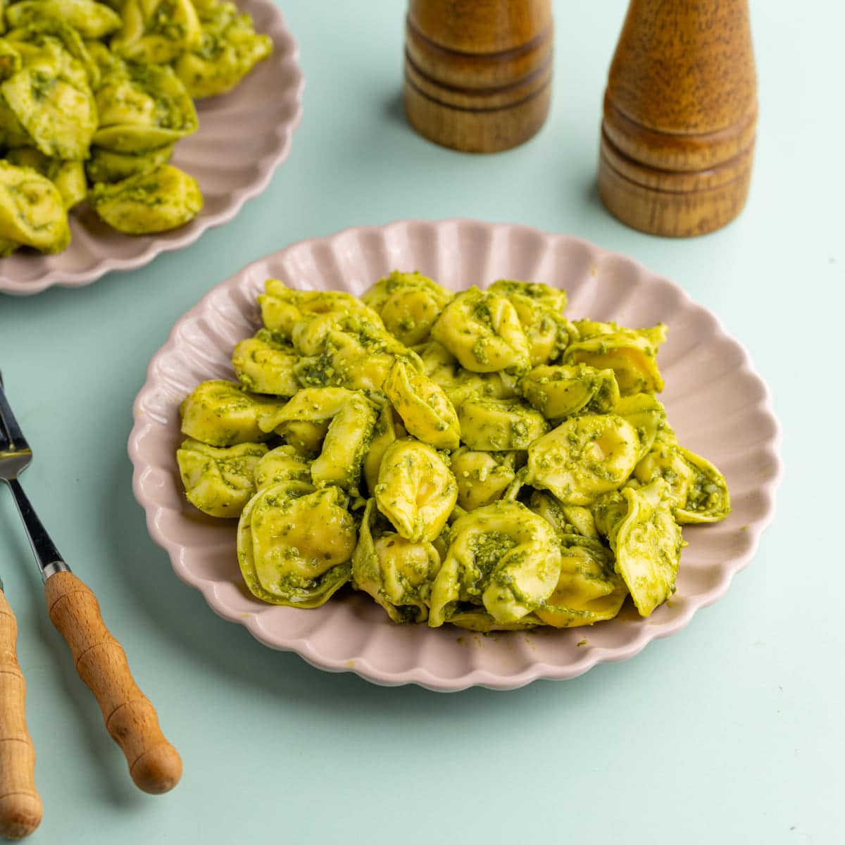 2-Ingredient Pesto Tortellini served up on a pink plate