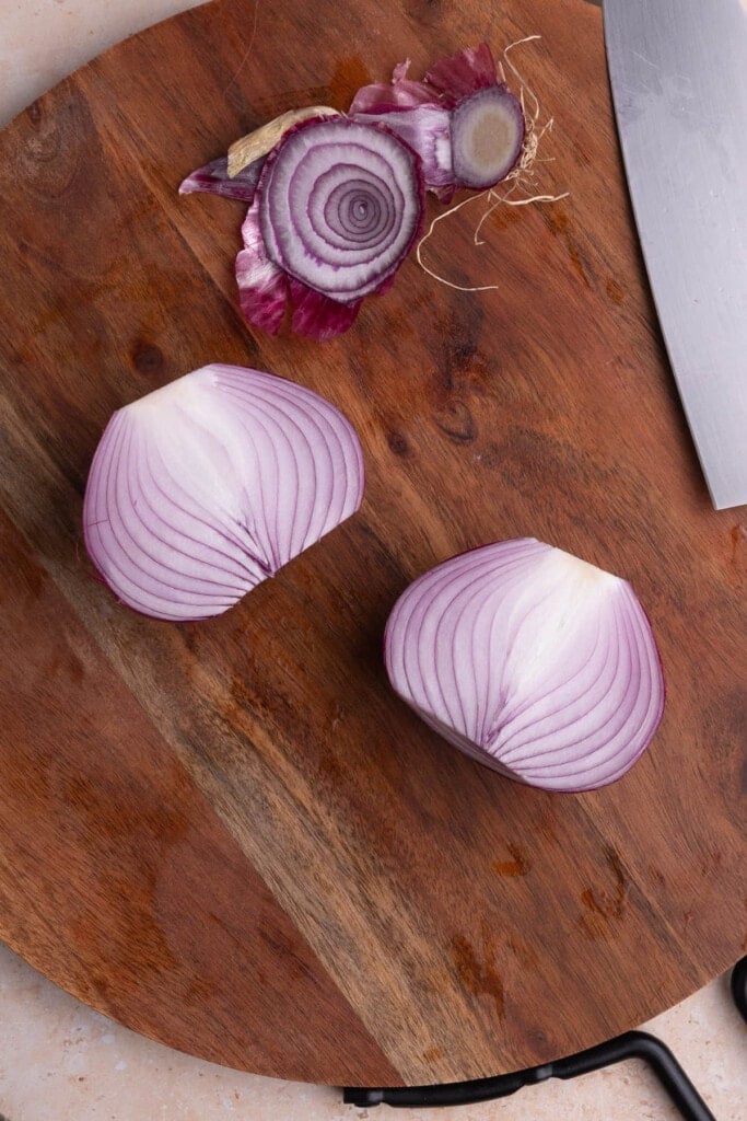 Slicing red onion in half and chopping off ends