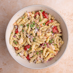 Seafood Pasta Salad ready to serve in a large mixing bowl