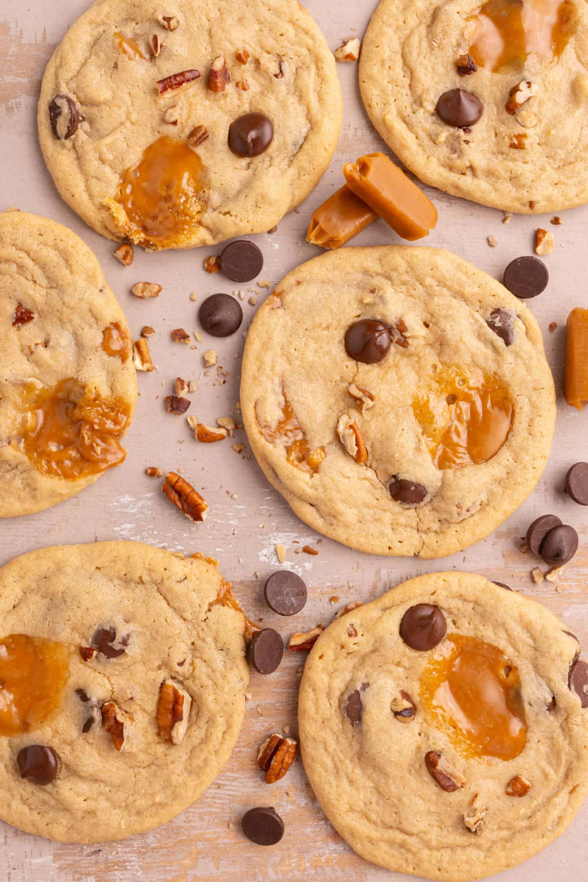 Overhead image of cookies with pecans, caramel, and chocolate chips