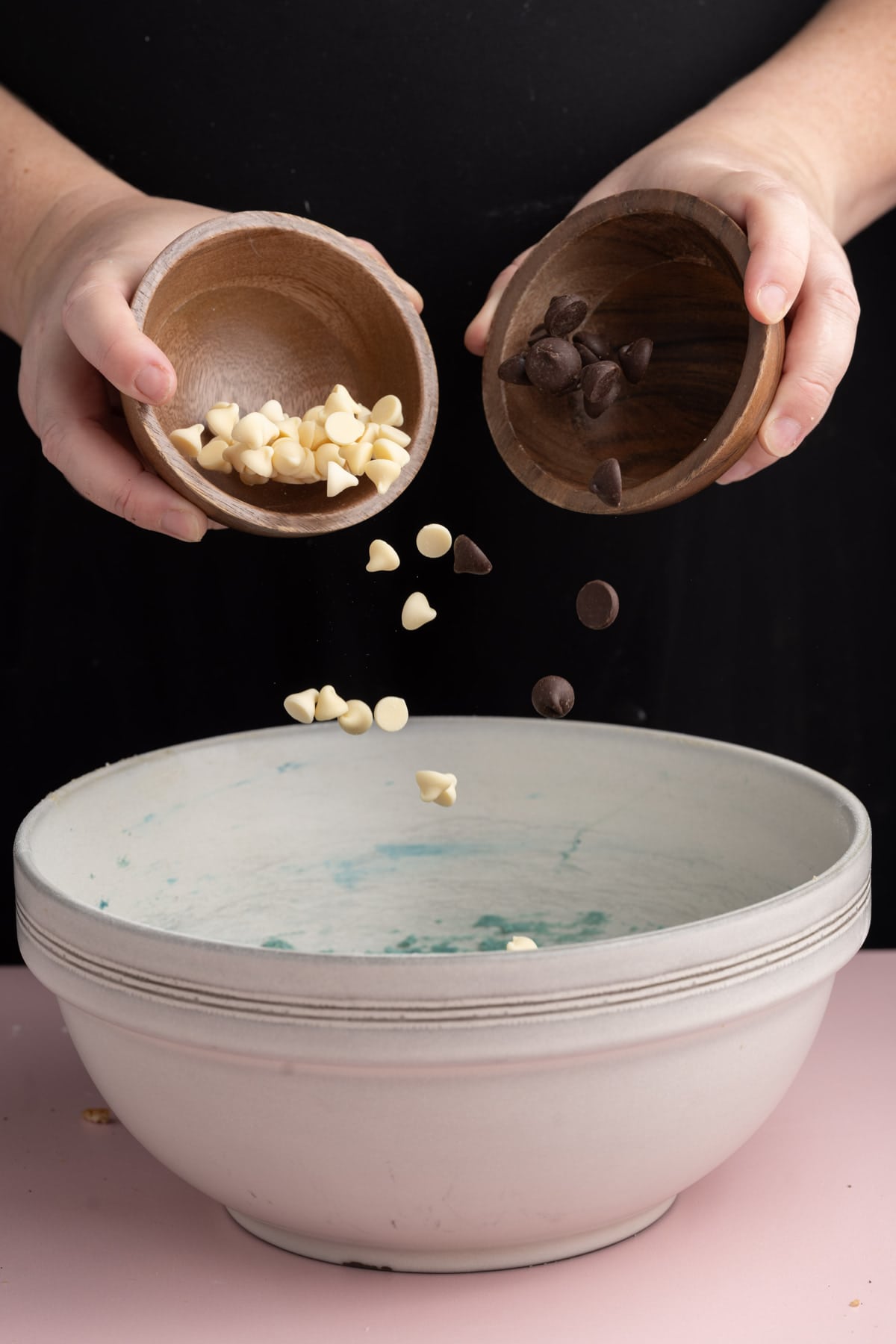 Adding white and dark chocolate chips to cookie dough