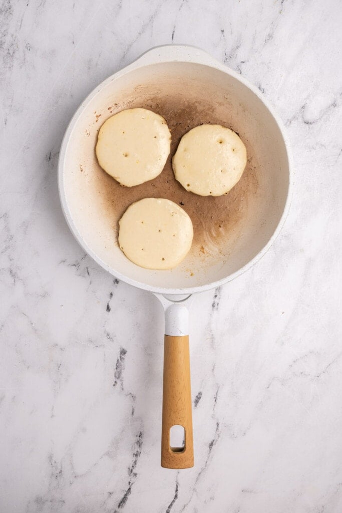 Frying lemon pancakes in hot butter