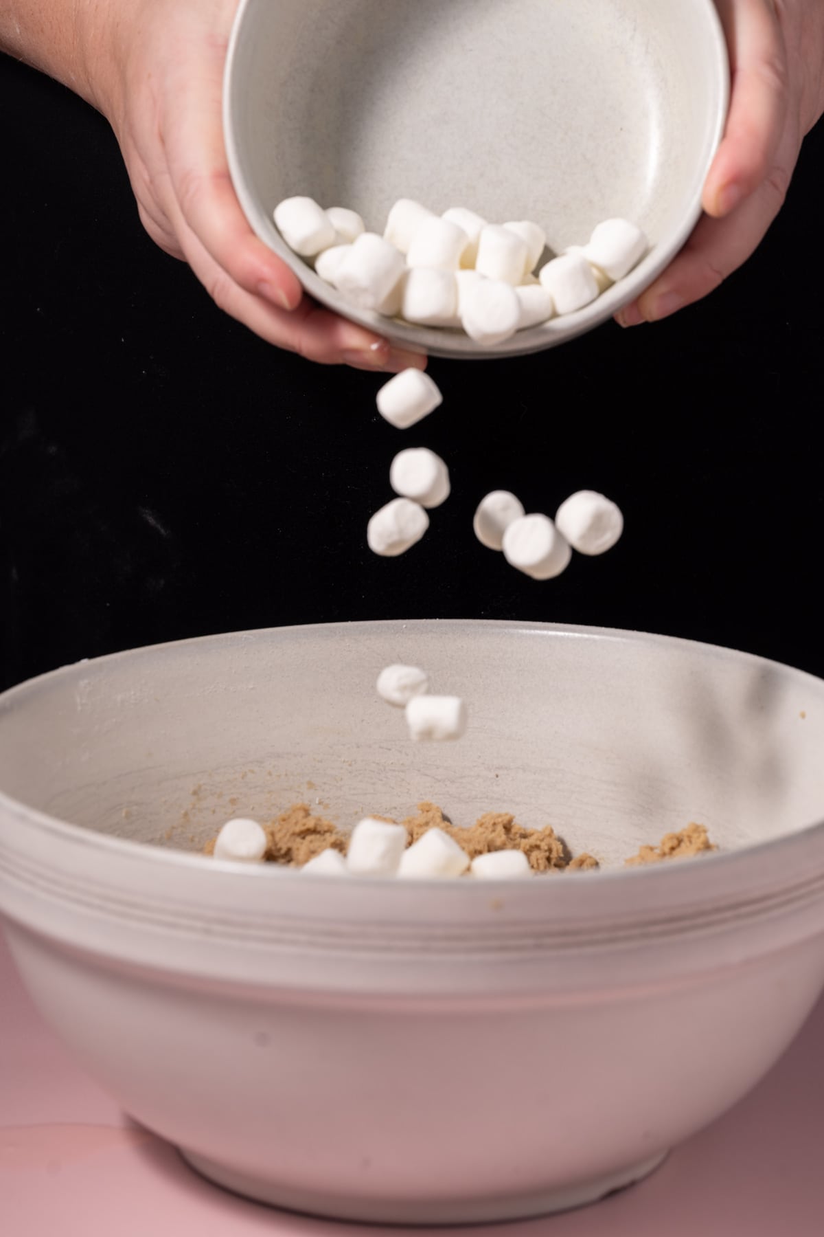 Adding mini marshmallows to cookie dough