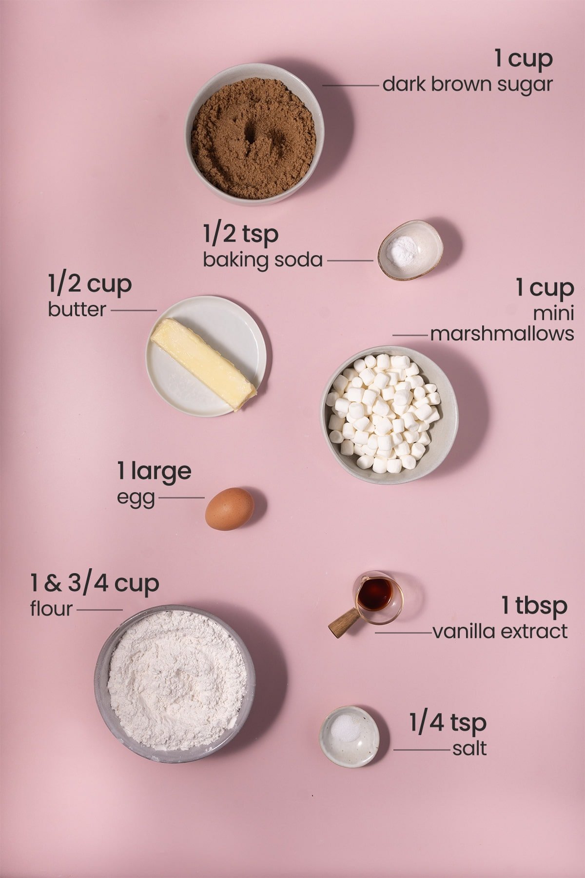 ingredients for toasted marshmallow cookies - dark brown sugar, baking soda, butter, mini marshmallows, egg, vanilla extract, flour, salt