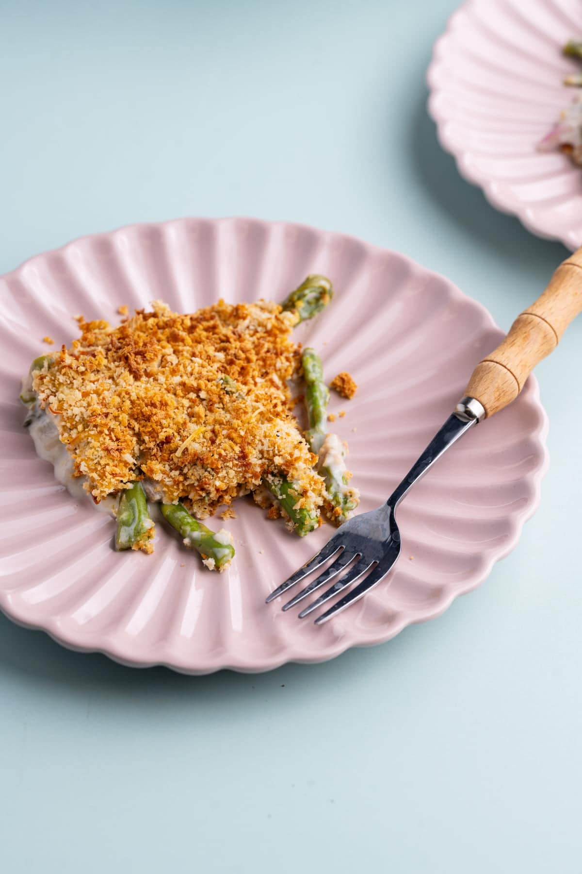 Asparagus Casserole with crispy Panko top served on a plate with a fork