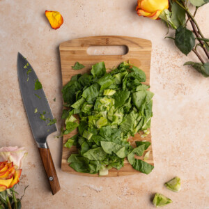 Roughly chopped romaine lettuce on a chopping board