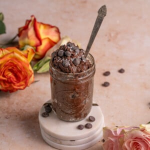 Edible Brownie Batter served in a glass jar with a spoon
