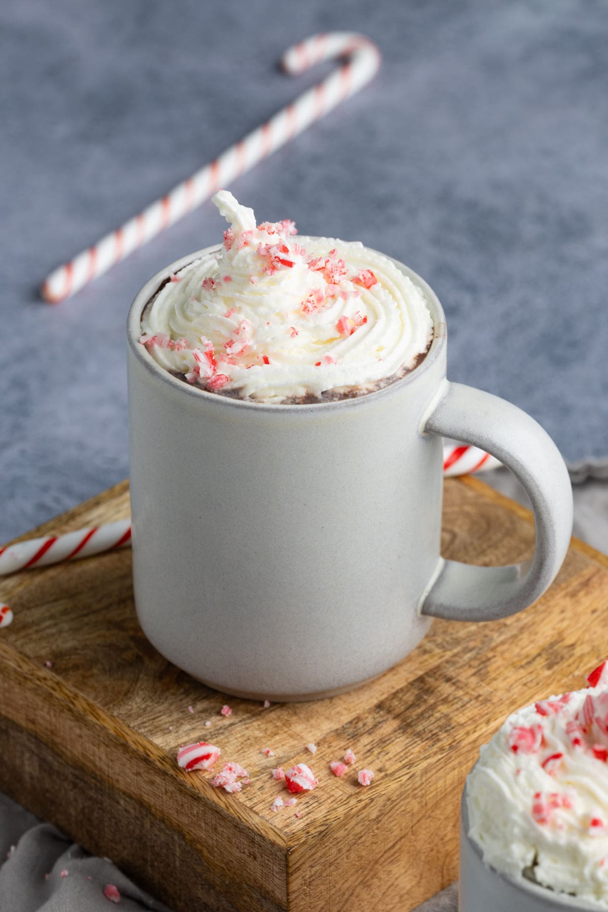 Peppermint Hot Chocolate garnished with whipped cream and crushed candy cane