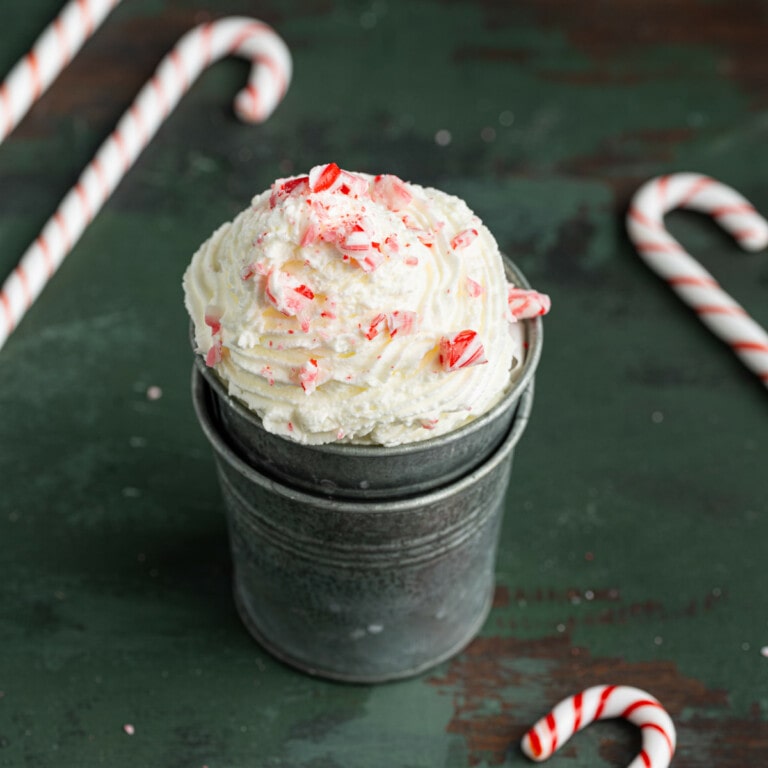 Close up of peppermint whipped cream with crushed candy cane on top