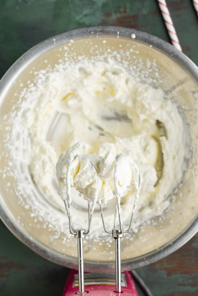 Whipping cream until stiff peaks form