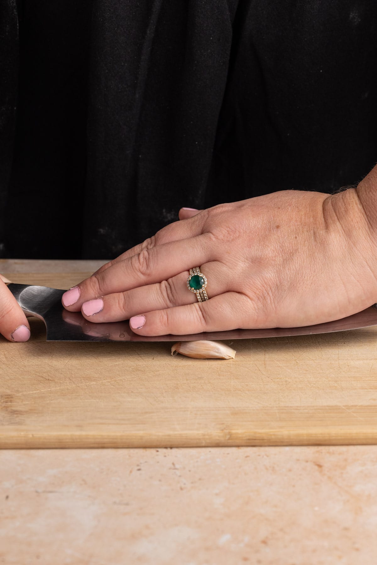 Crushing garlic to easily peel it