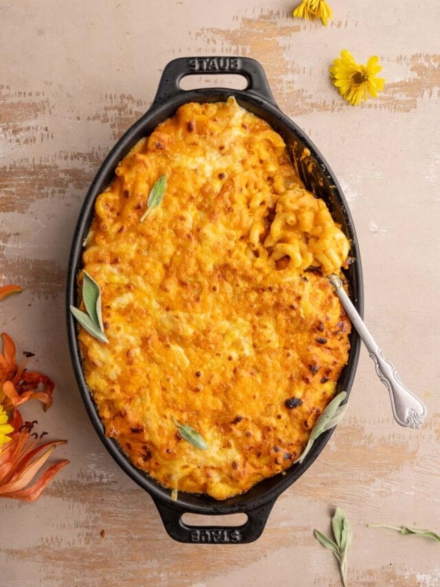 Baked mac and cheese with a serving spoon in it