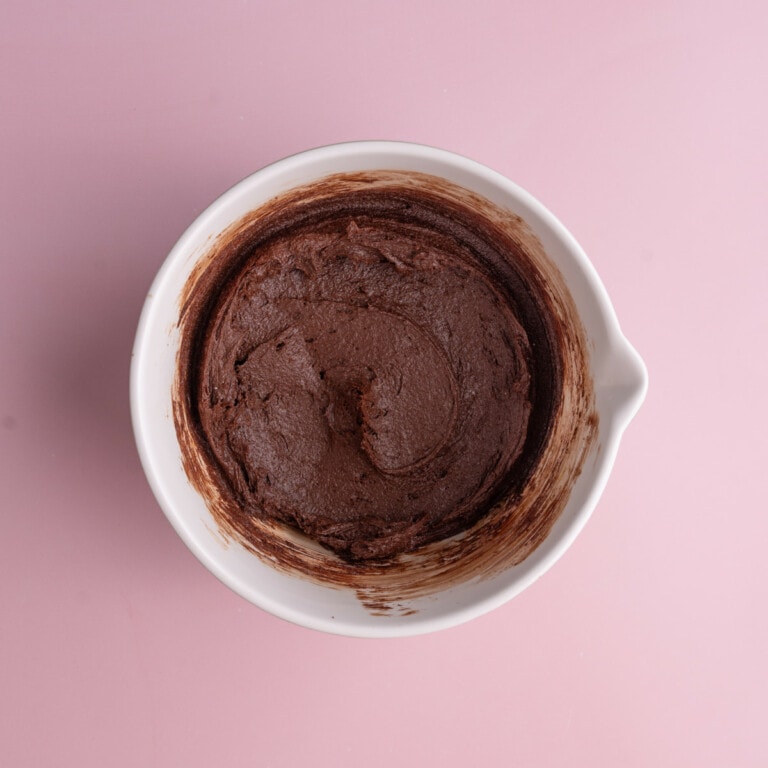 Thick brownie batter in a mixing bowl.