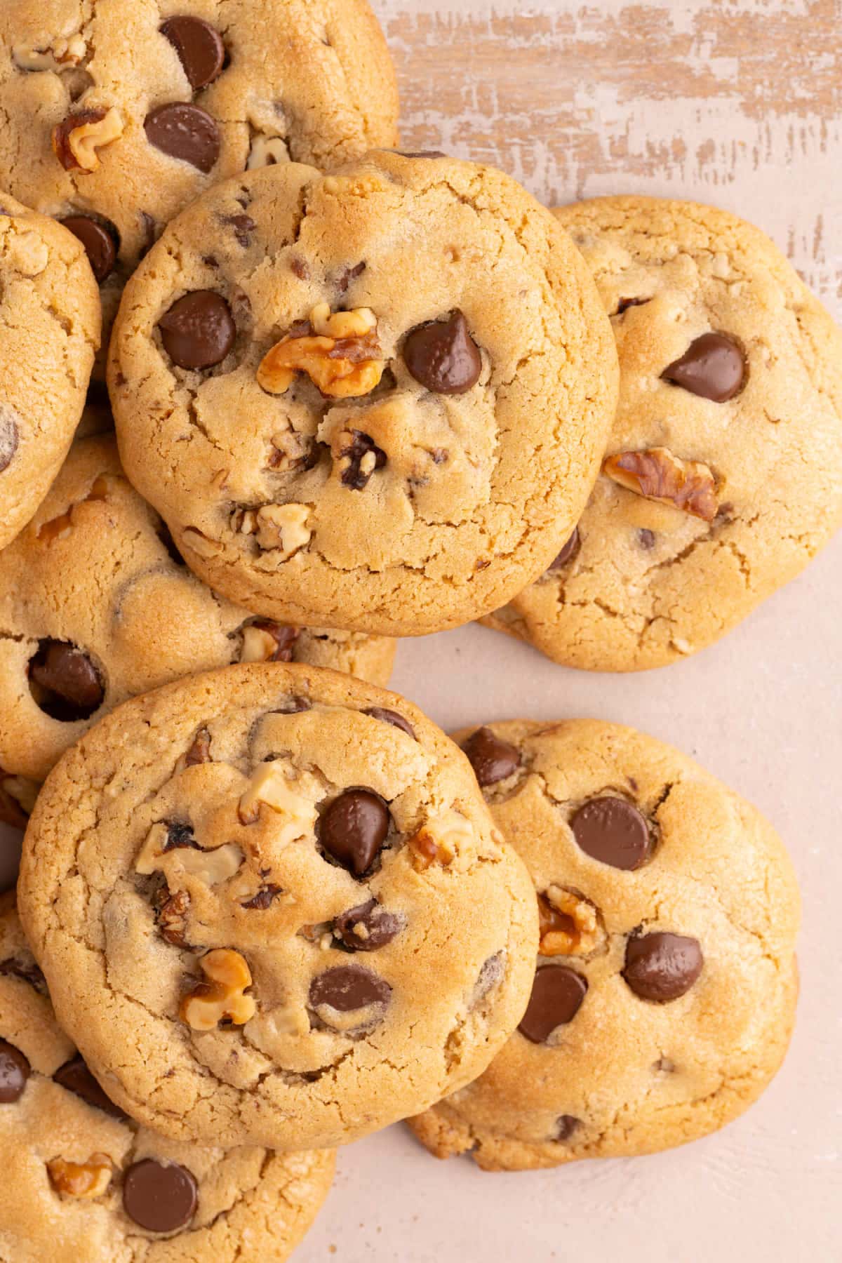Overhead image of Chocolate Chip Walnut Cookies piled on top of each other.