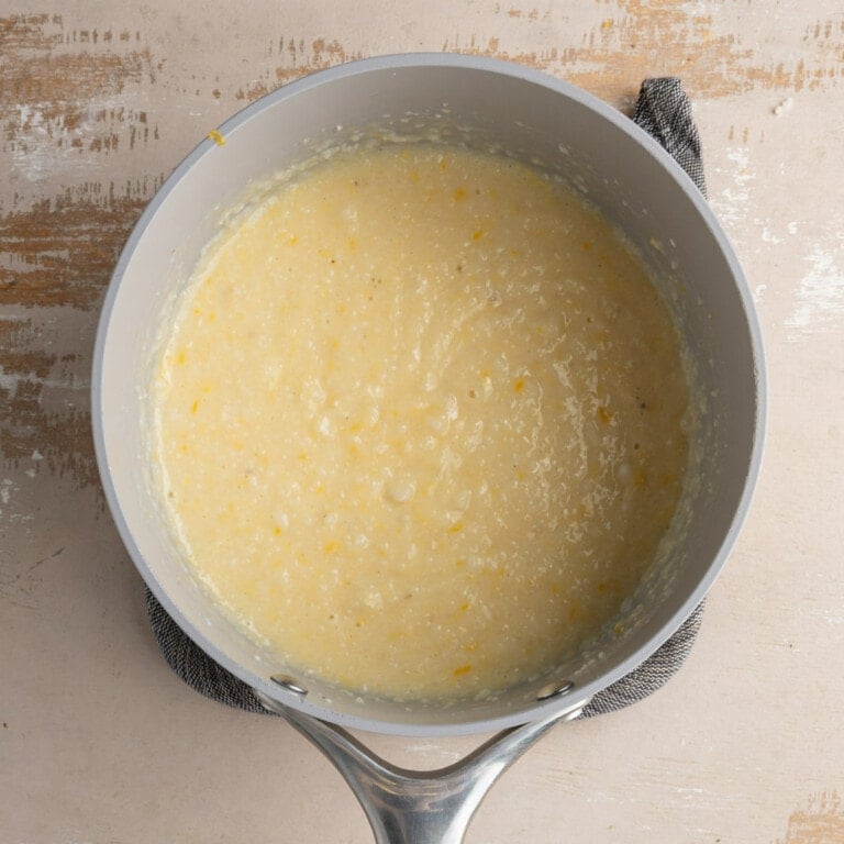 Creamy grits with milk and cheddar cheese