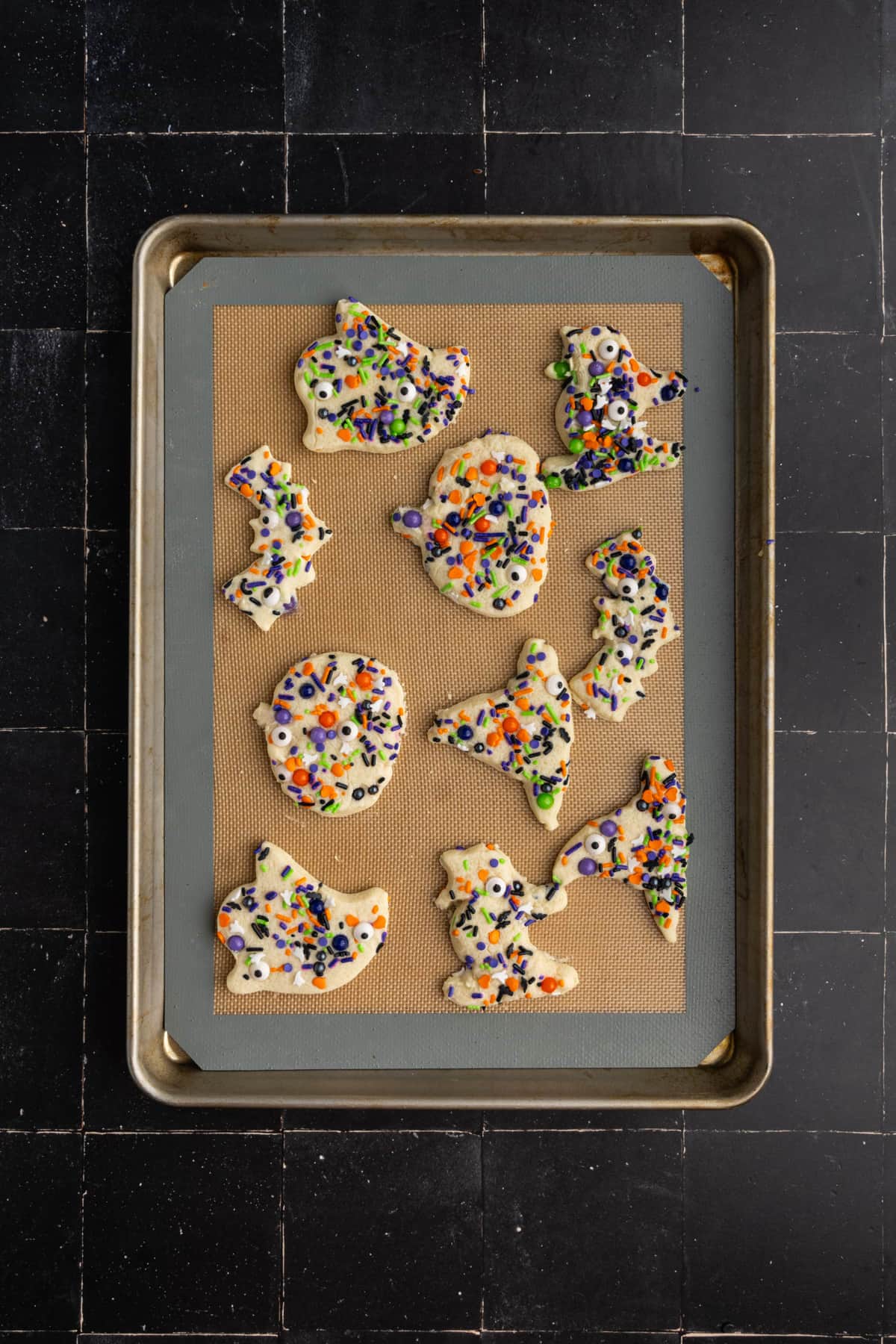 Halloween shaped sugar cut out cookies with sprinkles.